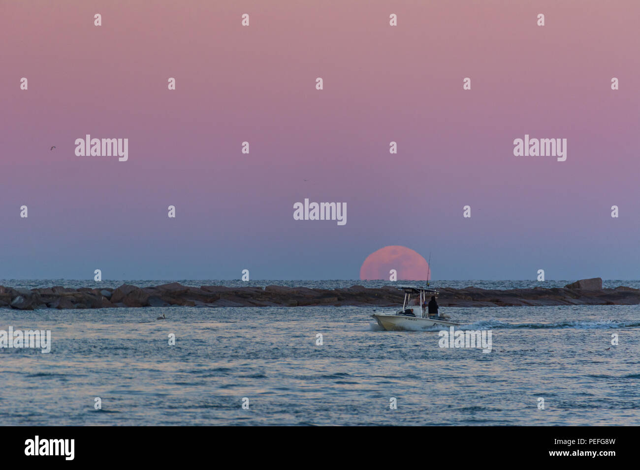 Ore del sorgere su una spiaggia sul Texas Gulf Coast presso sunrise Foto Stock