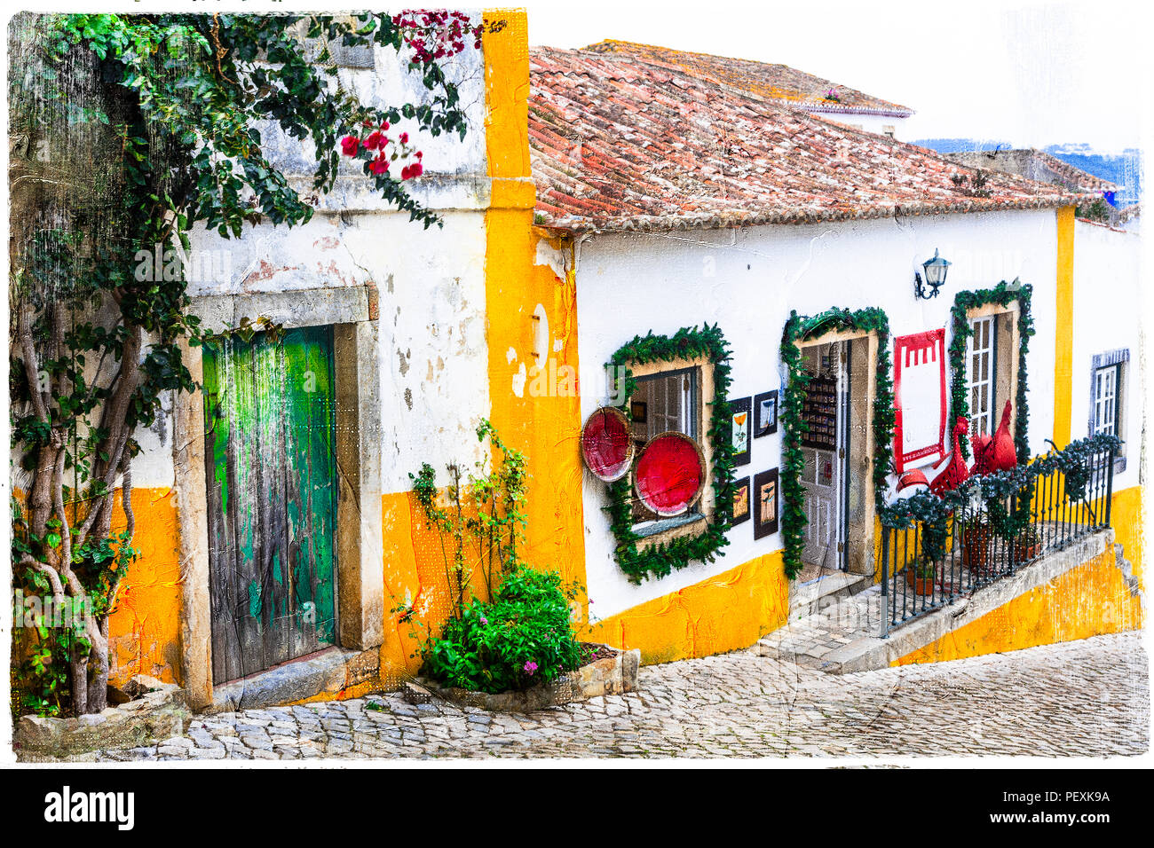 Tradizionale villaggio di Obidos,vista con la decorazione floreale,Portogallo. Foto Stock