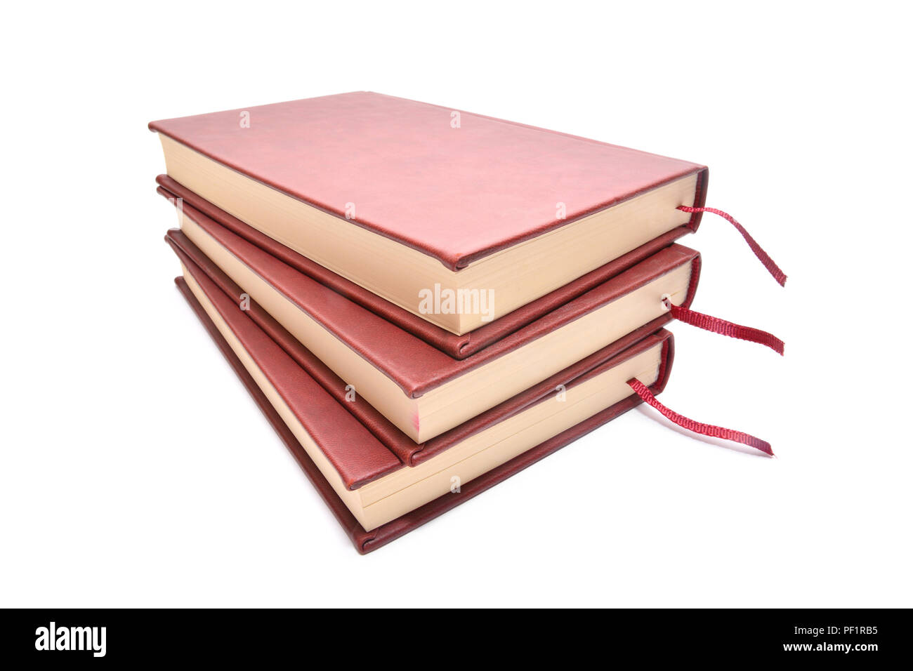 Pila di tre libri isolato su bianco Foto Stock