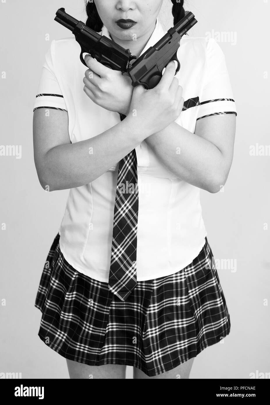 School girl con pistole Foto Stock