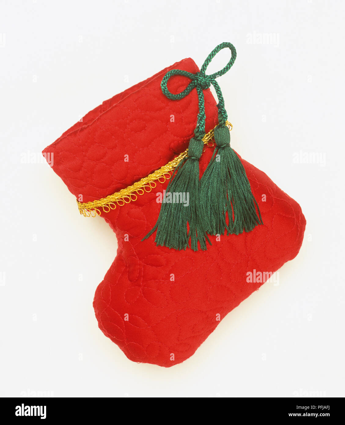 Red calza di Natale con nappe verde Foto Stock
