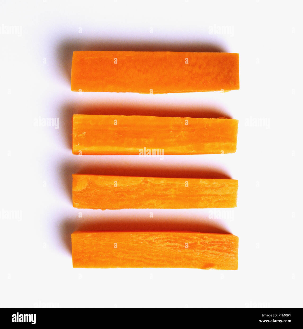 Quattro bastoncini di carote Foto Stock