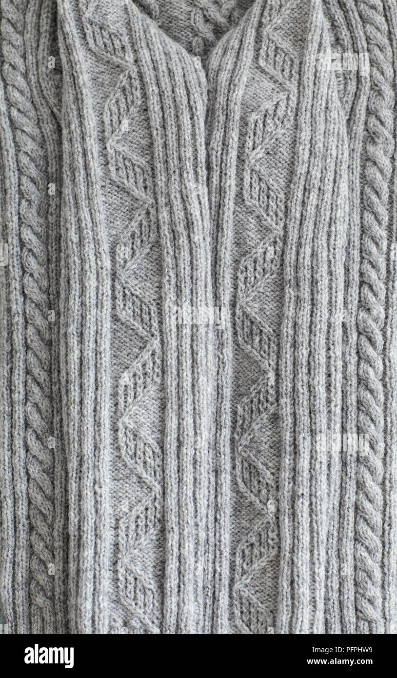 Maglia grigia maglione Aran, close-up di manicotti Foto Stock