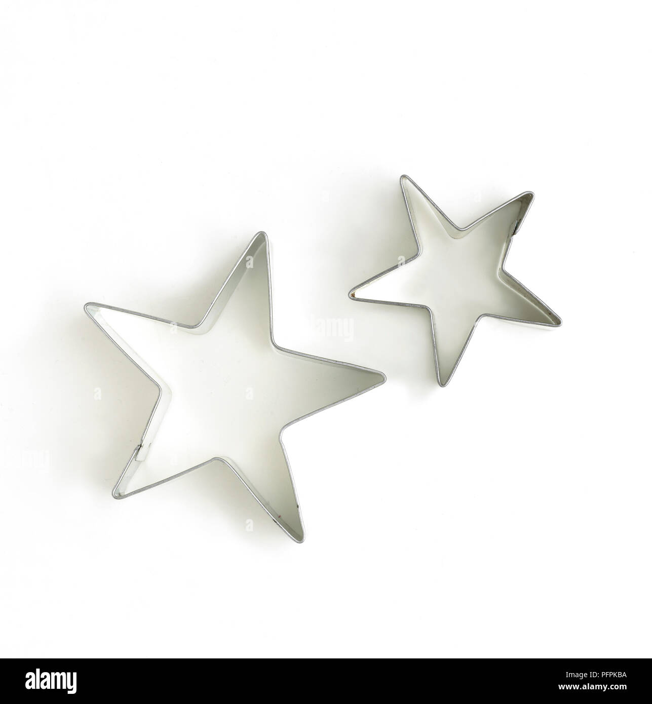 Due stelle di pasta frolla a forma di coltelli Foto Stock