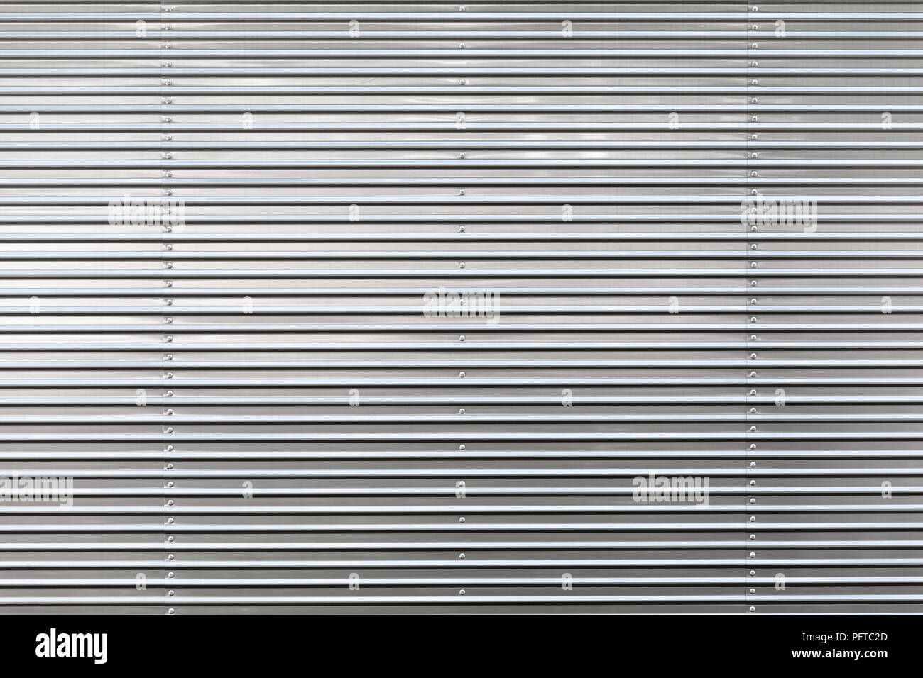 Close-up di semplificazione pulite e brillanti di colore grigio metallico sullo sfondo (copia spazio) Foto Stock