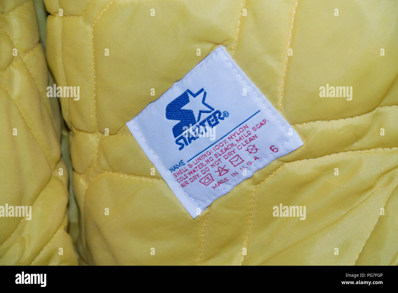 Il motorino di avviamento giacca etichetta di cura - USA Foto Stock