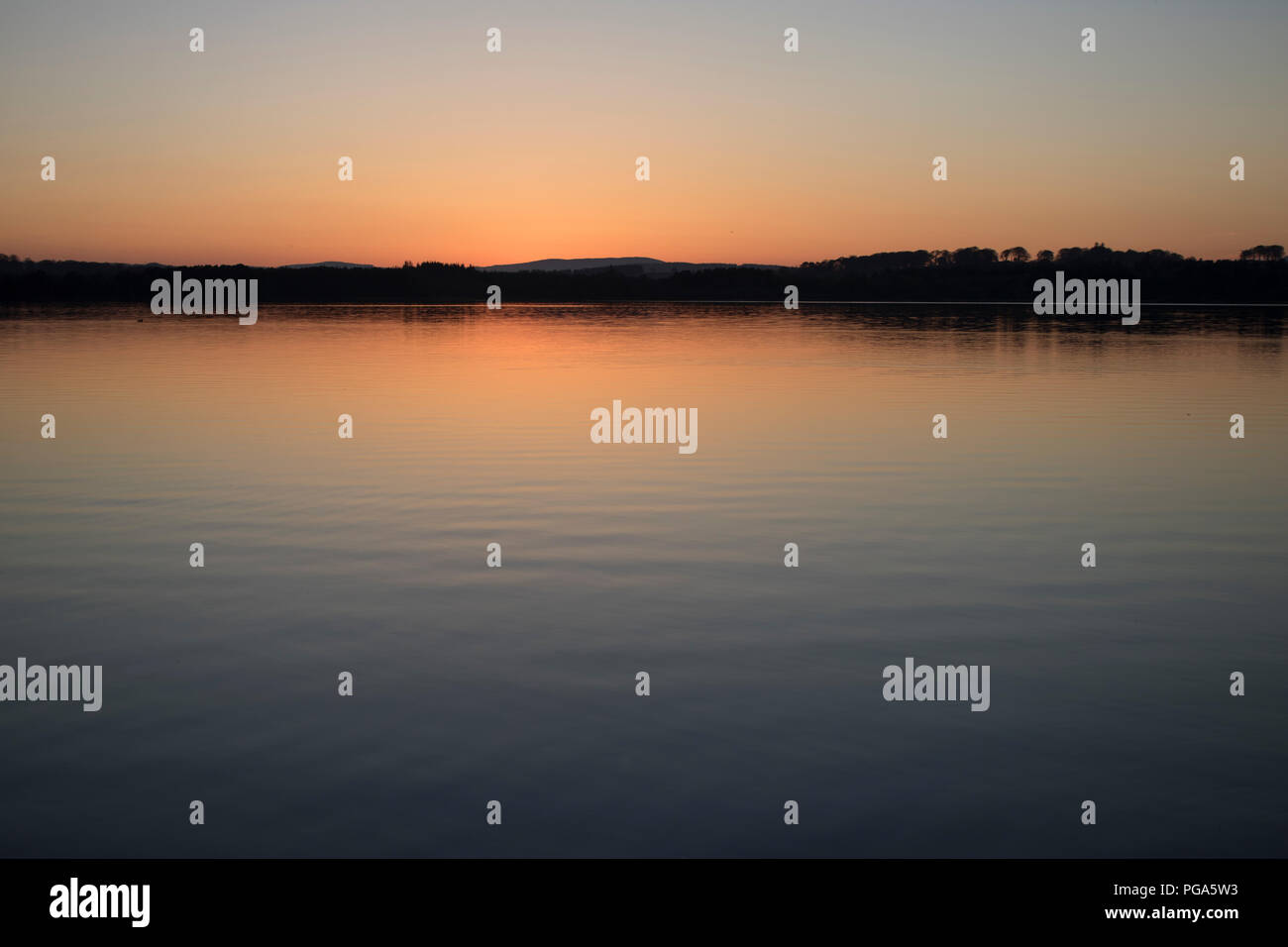 Tramonto su Loch di Skene Foto Stock