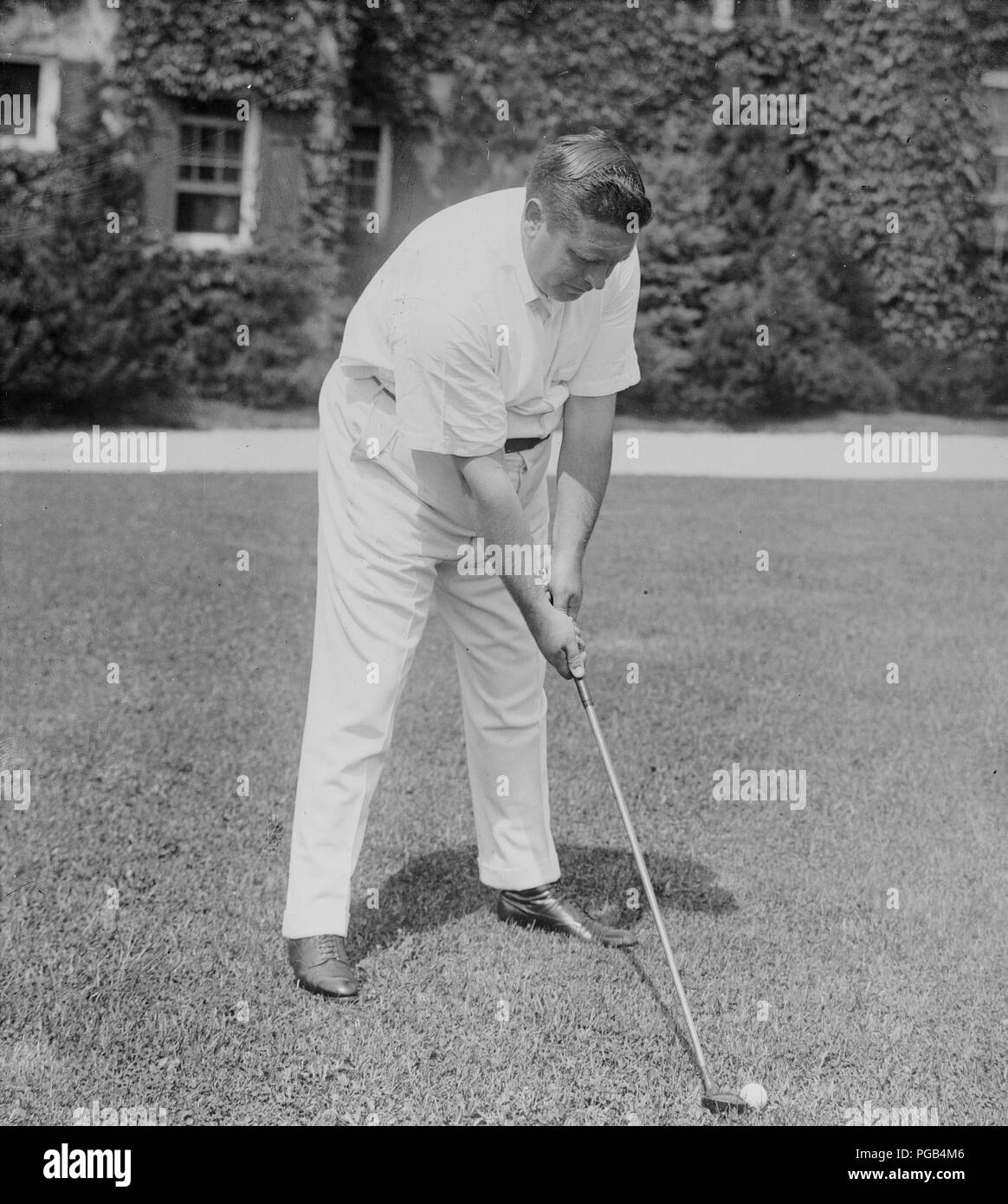 Fotografia mostra Irish American tenor cantante John McCormack (1884-1945) con golf club Foto Stock