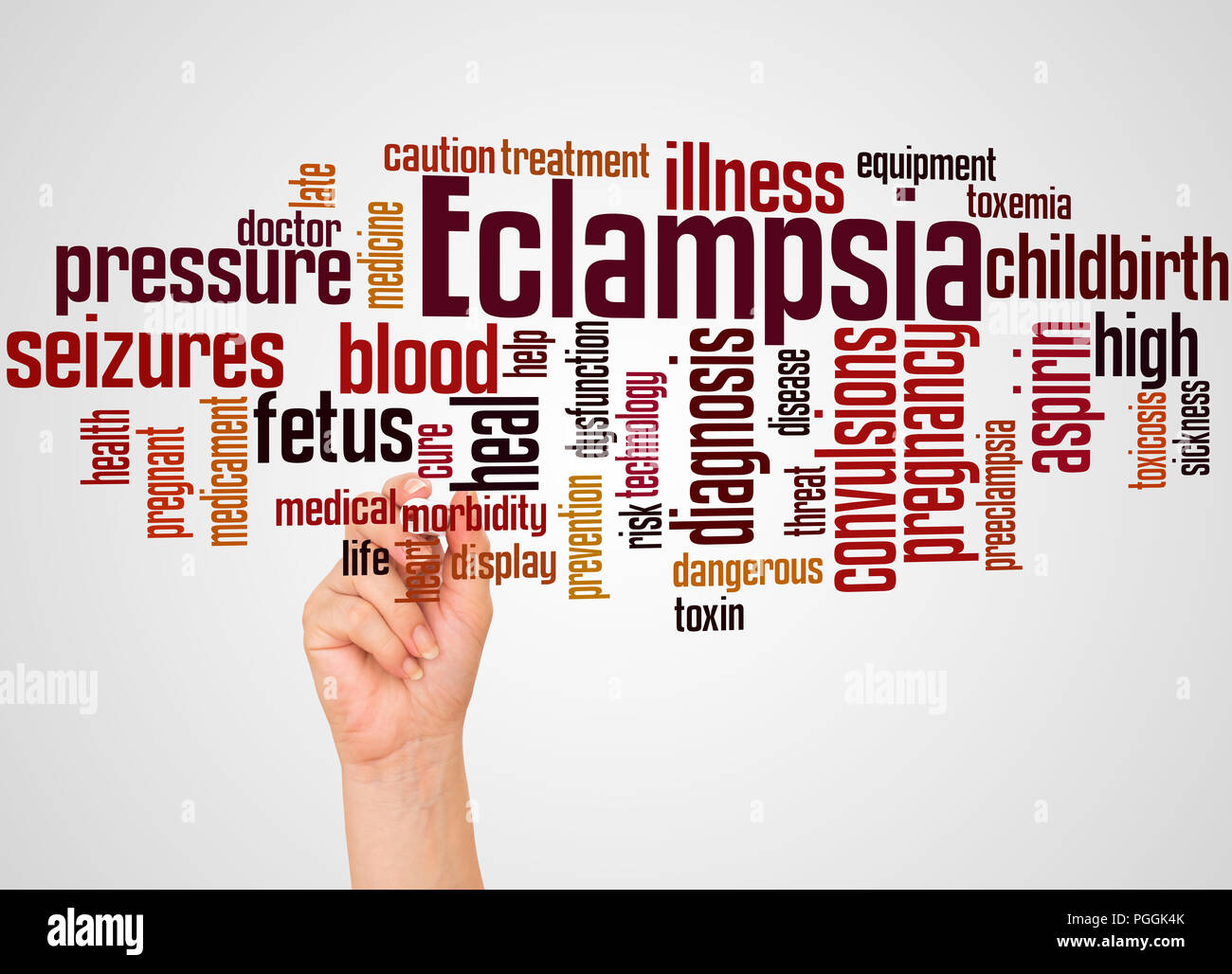 L'eclampsia word cloud e la mano con il concetto di marcatore sul gradiente dello sfondo. Foto Stock