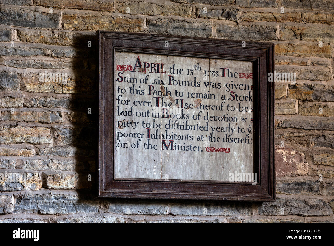 Povero segno della carità nella Chiesa di St. Michael, Churchill, Worcestershire, England, Regno Unito Foto Stock