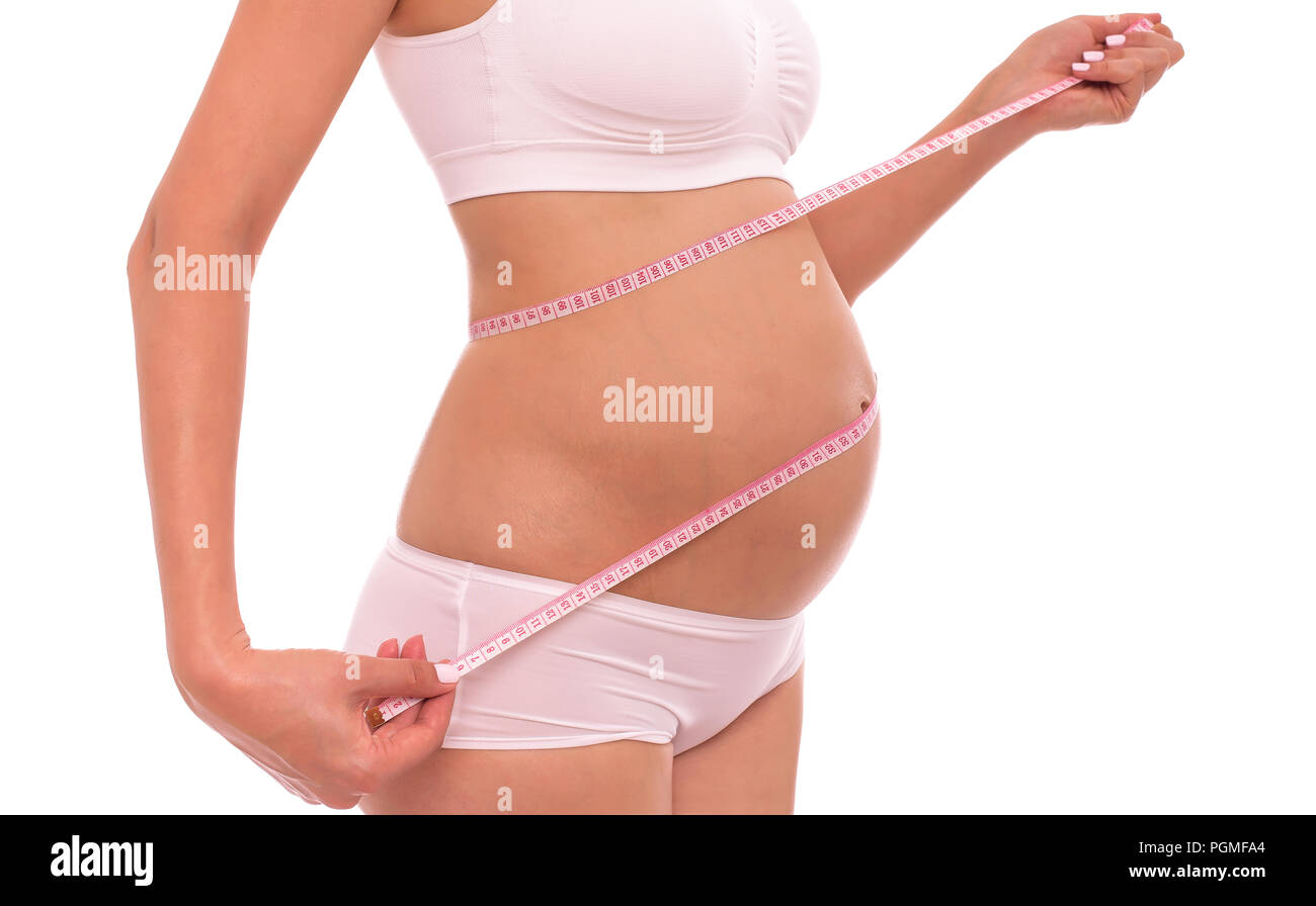 La gravidanza. Misurare il ventre con un centimetro di nastro. Foto Stock