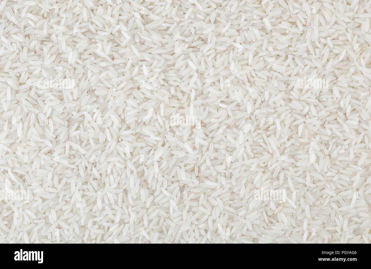 Bianco crudo del riso a grani lunghi sfondo Foto Stock
