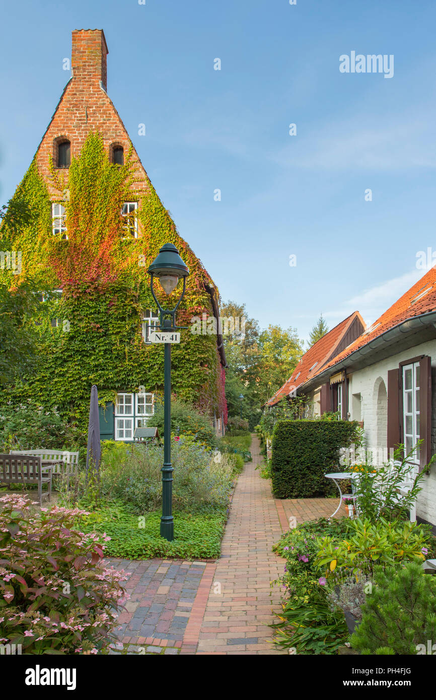 Vicolo Glandorps pista con piccole case, chiamato Buden. Hansestadt Lubecca, Schleswig-Holstein, Germania Foto Stock