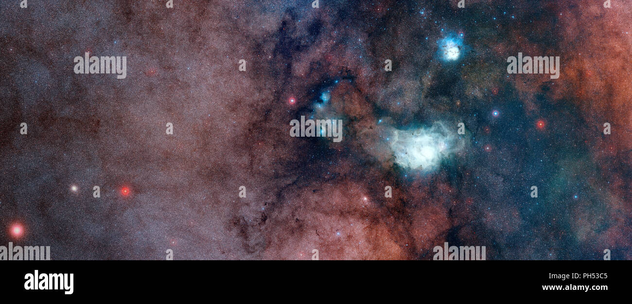 Dense nubi di stelle e polvere nella Via Lattea, con la laguna e nebulose Trifid Foto Stock