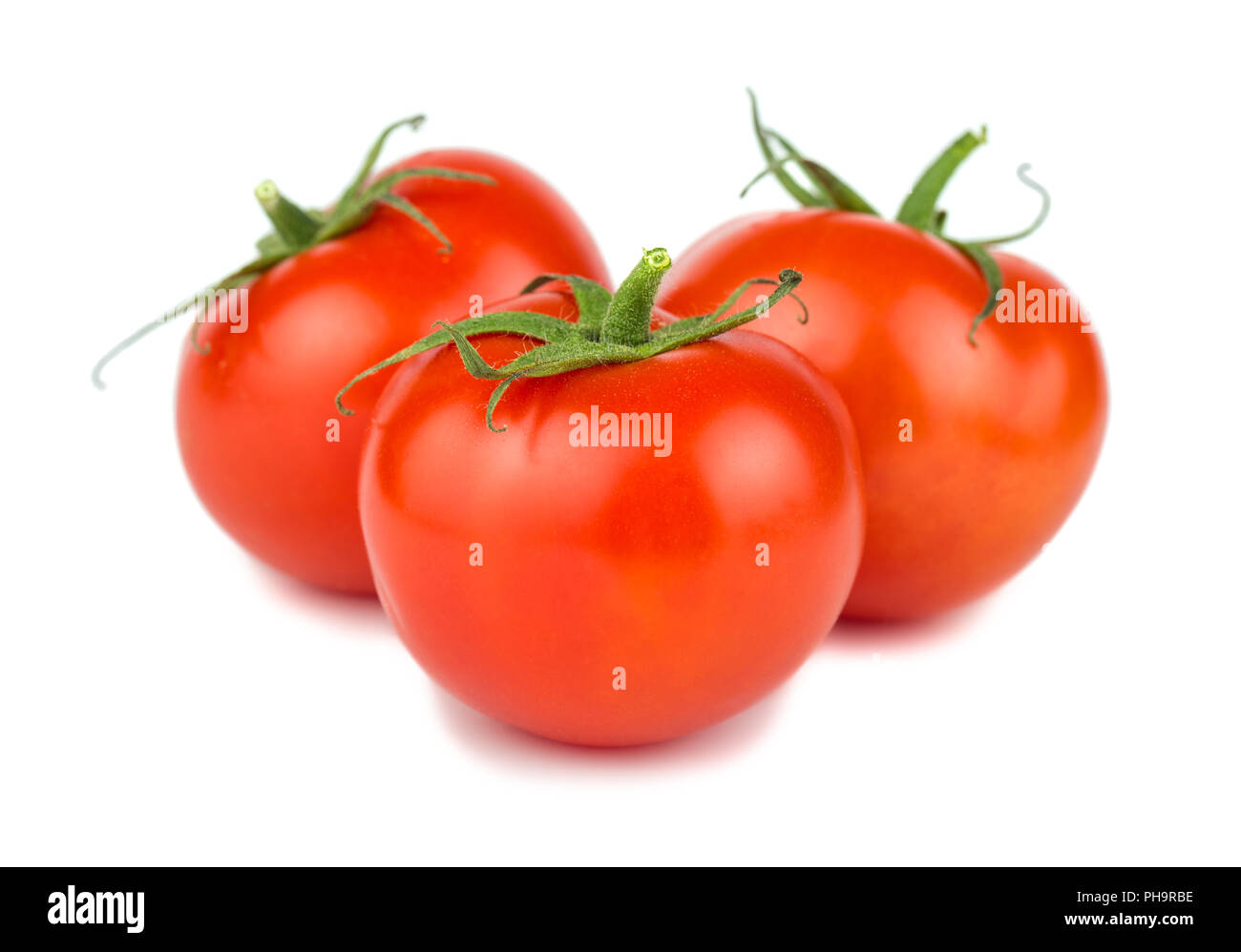 Tre rossi pomodori maturi Foto Stock