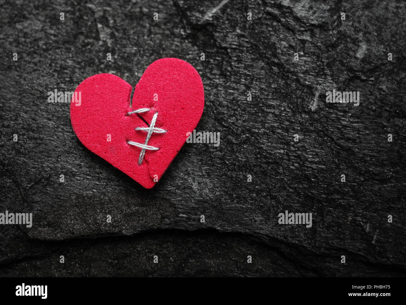 Cucito cuore rosso Foto Stock