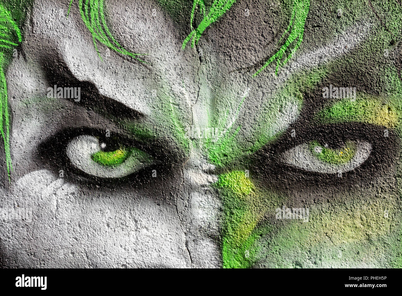 Volto dipinto sul muro Foto Stock