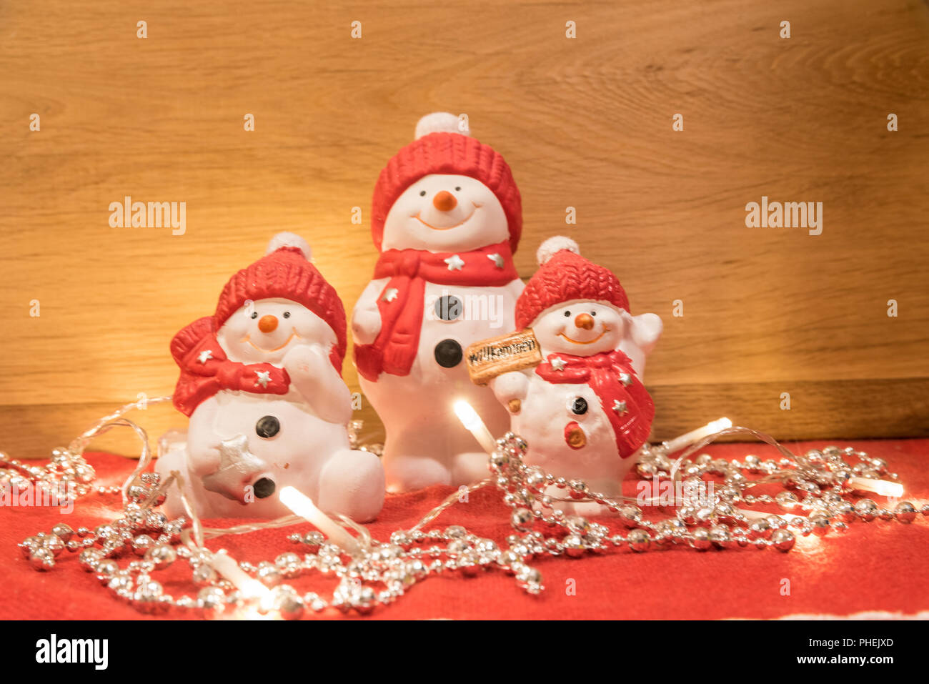 Gli snowmen brillano con dolce benvenuto Foto Stock