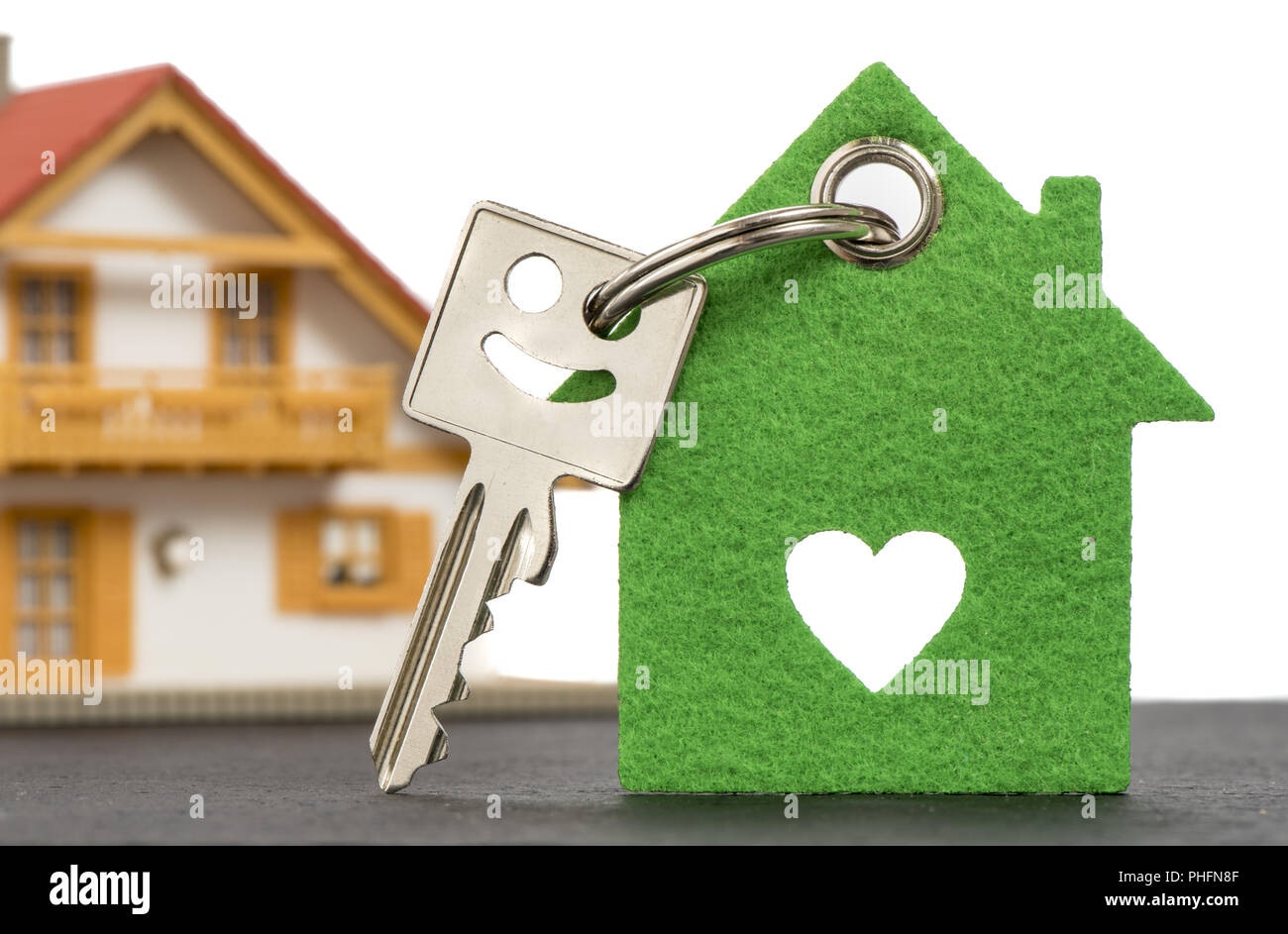 Chiave di casa con il modello di casa Foto Stock