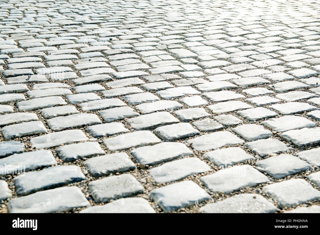 Strada pavimentata con ciottoli per il tuo sfondo Foto Stock