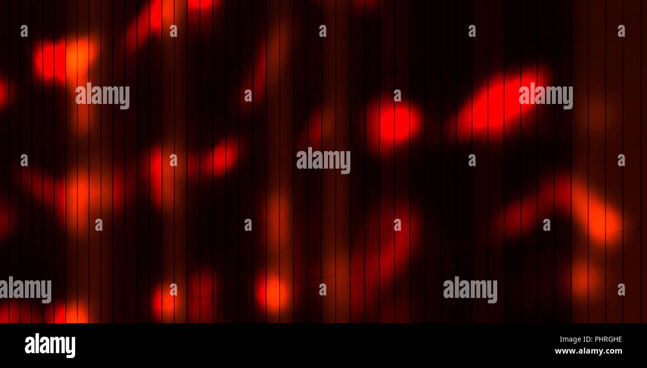 Notturna urbana sfondo astratto: macchie di luce rossa sul buio parteggiare per pannelli Foto Stock