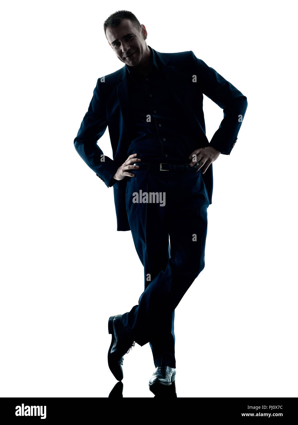 Un caucasian business man standing silhouette isolati su sfondo bianco Foto Stock
