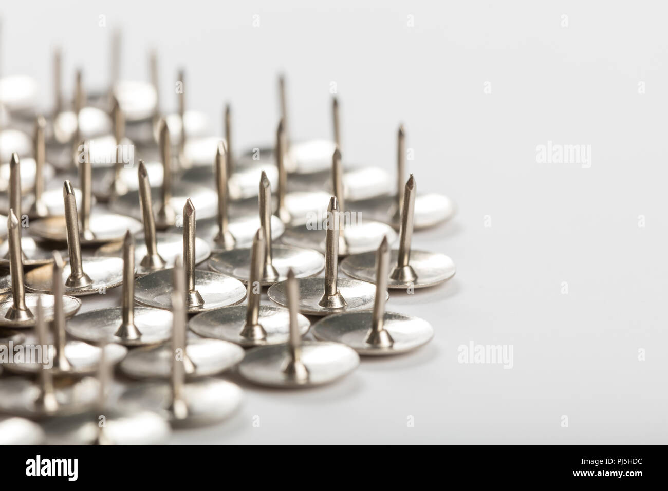 Gruppo di pollice in metallo semenze per lo sfondo Foto Stock