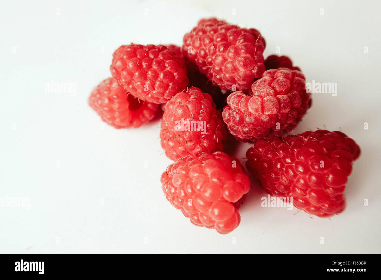 Frutti di bosco Lamponi su sfondo bianco Foto Stock