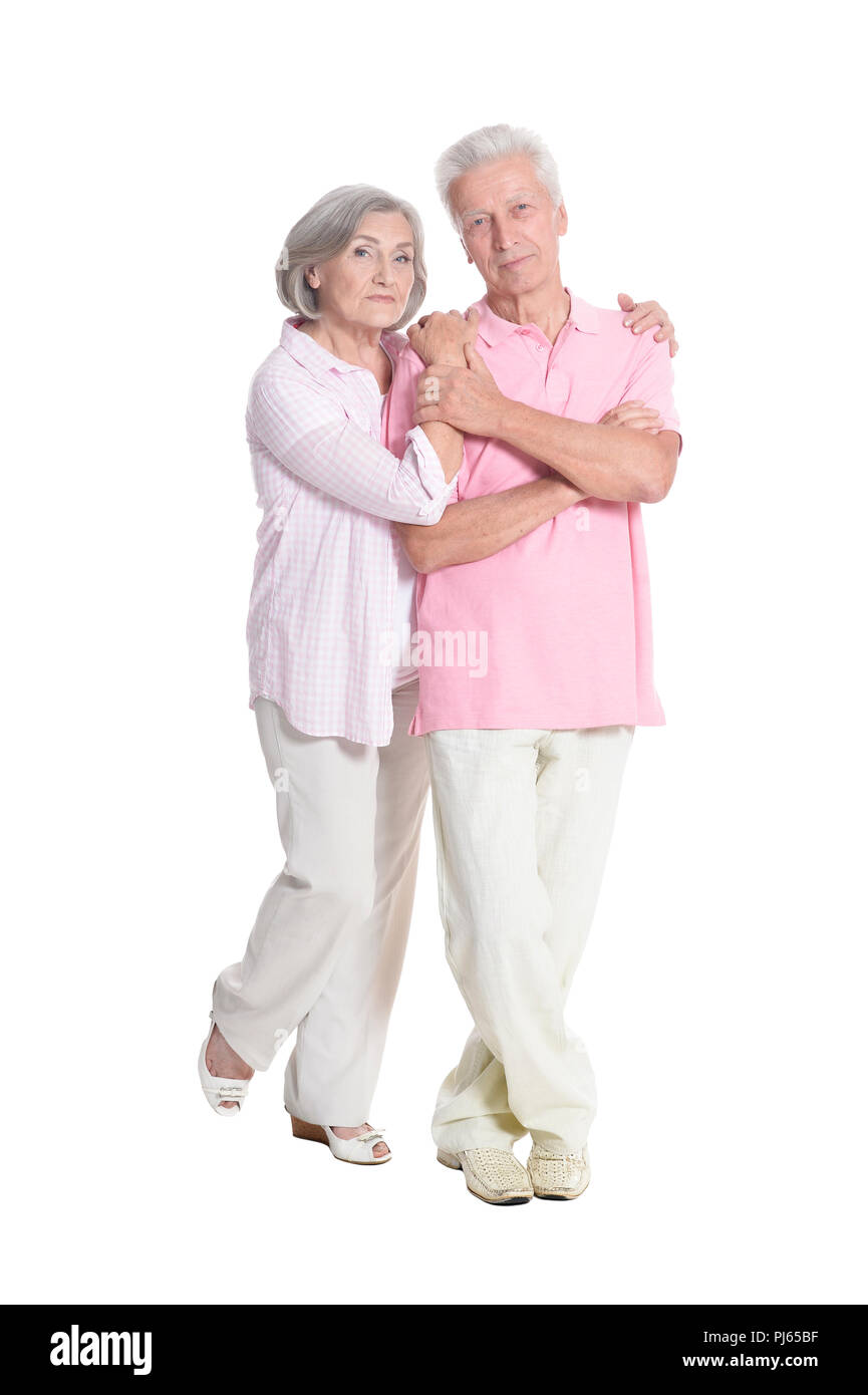 Ritratto di coppia senior abbracciando su sfondo bianco Foto Stock