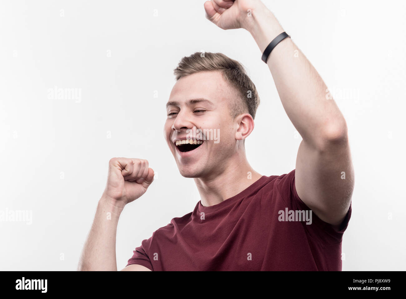 Biondo e sensazione di studenti molto divertente e contento dopo il passaggio di esame Foto Stock