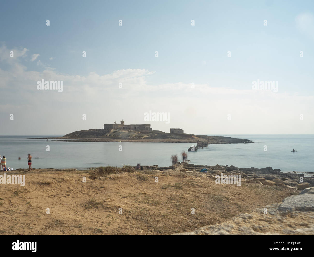 Ore diurne lunga esposizione effettuata con filtri ND al tramonto di isola delle Correnti Foto Stock