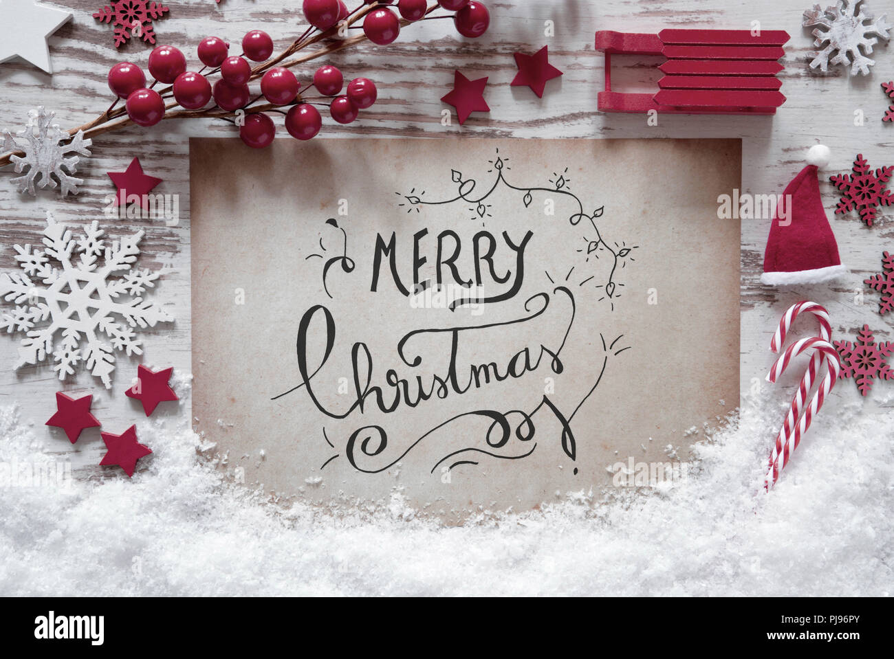 Red decorazione di Natale, neve, Calligrafia Buon Natale Foto Stock