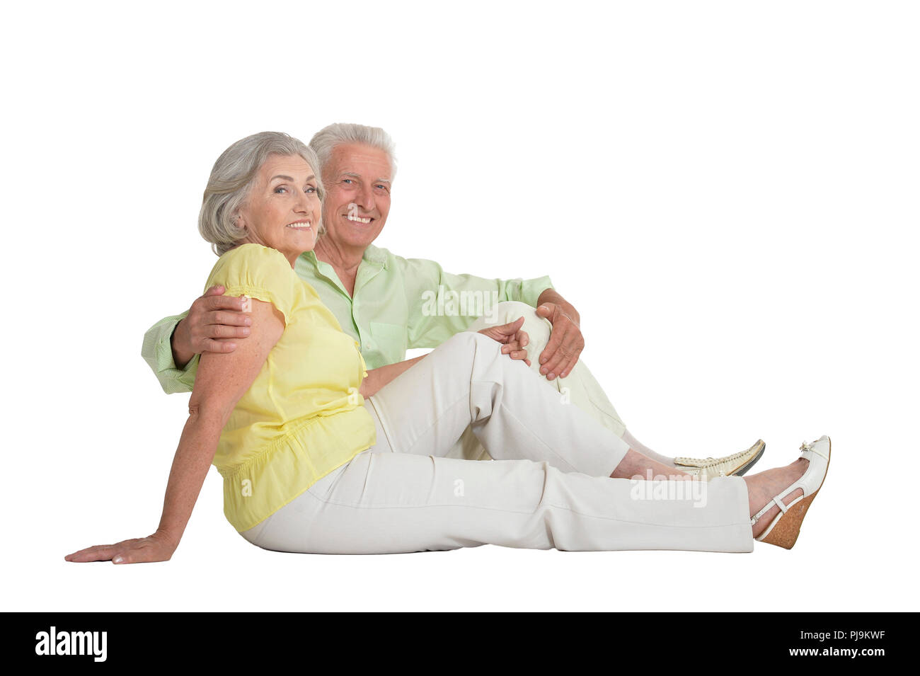Ritratto di coppia senior seduto e abbracciando Foto Stock