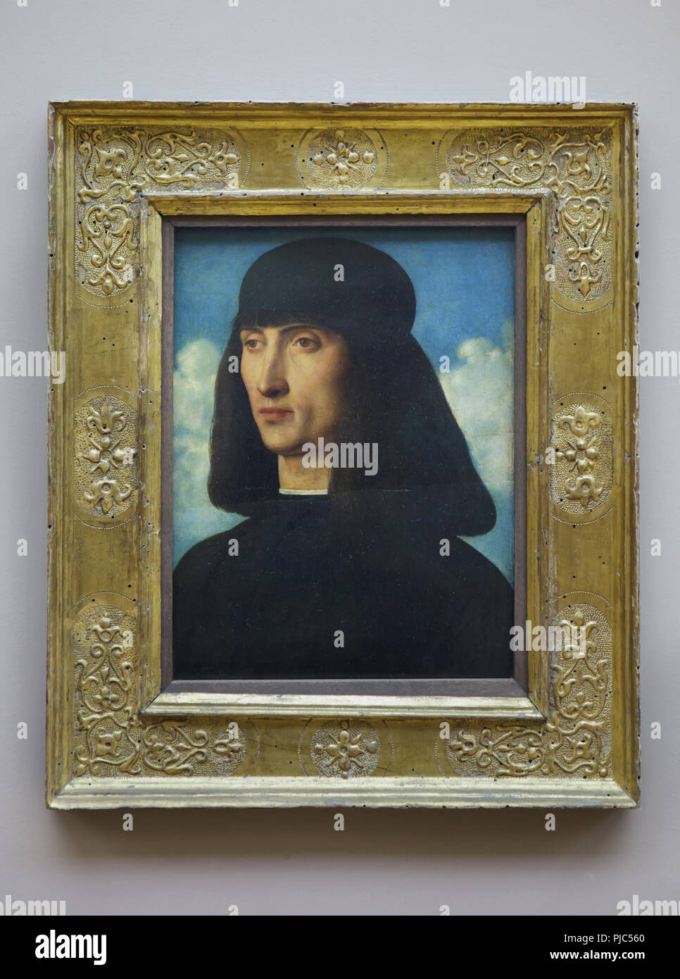 Ritratto di un uomo dal Rinascimento italiano pittore Giovanni Bellini (ca. 1490-1495) sul display al museo del Louvre a Parigi, Francia. Foto Stock