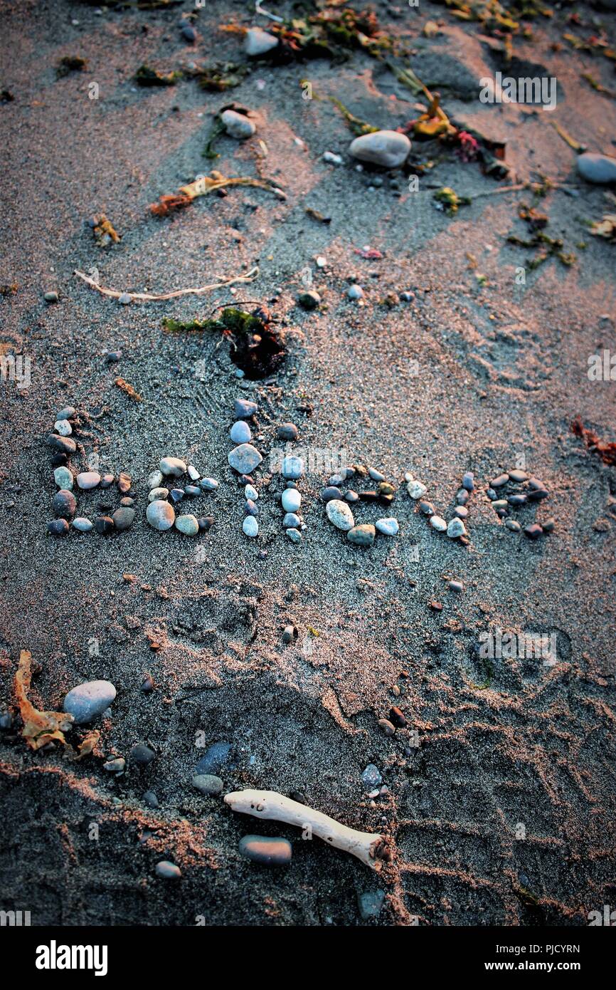 Credo scritto nella sabbia Foto Stock