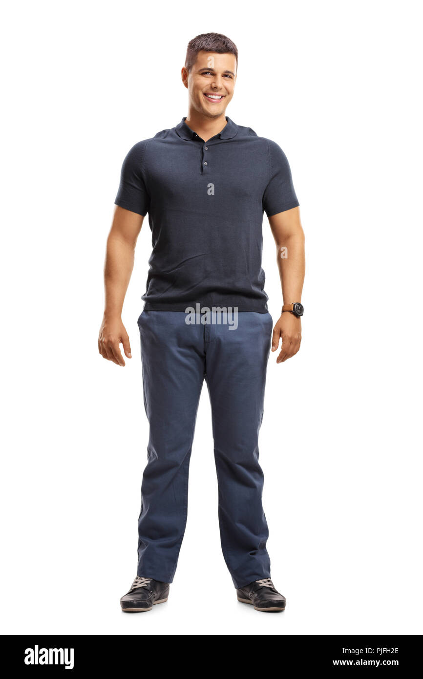 A piena lunghezza Ritratto di una giovane casual uomo in piedi e guardando la telecamera isolata su sfondo bianco Foto Stock