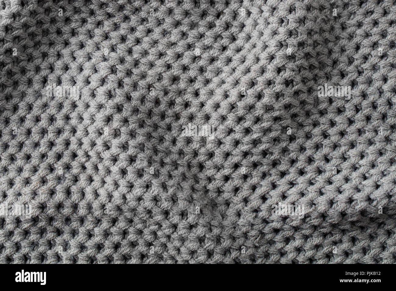 Grigio a maglia di lana sfondo texture pattern con alta risoluzione. Vista dall'alto. Spazio di copia Foto Stock