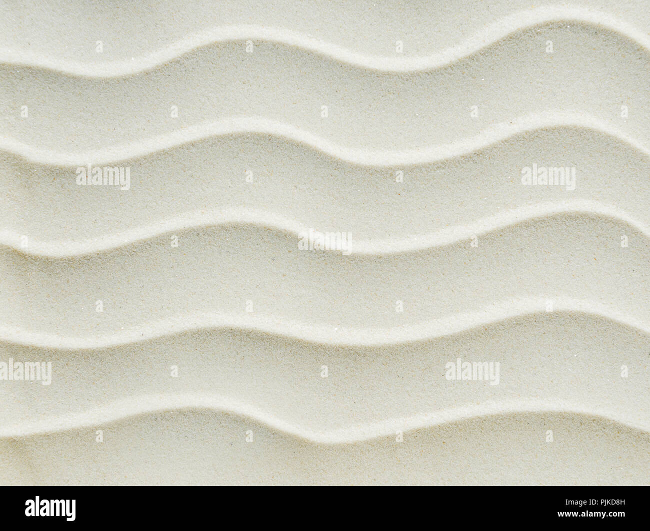 Bellissimo sfondo bianco di finissima sabbia pulita con onde Foto Stock