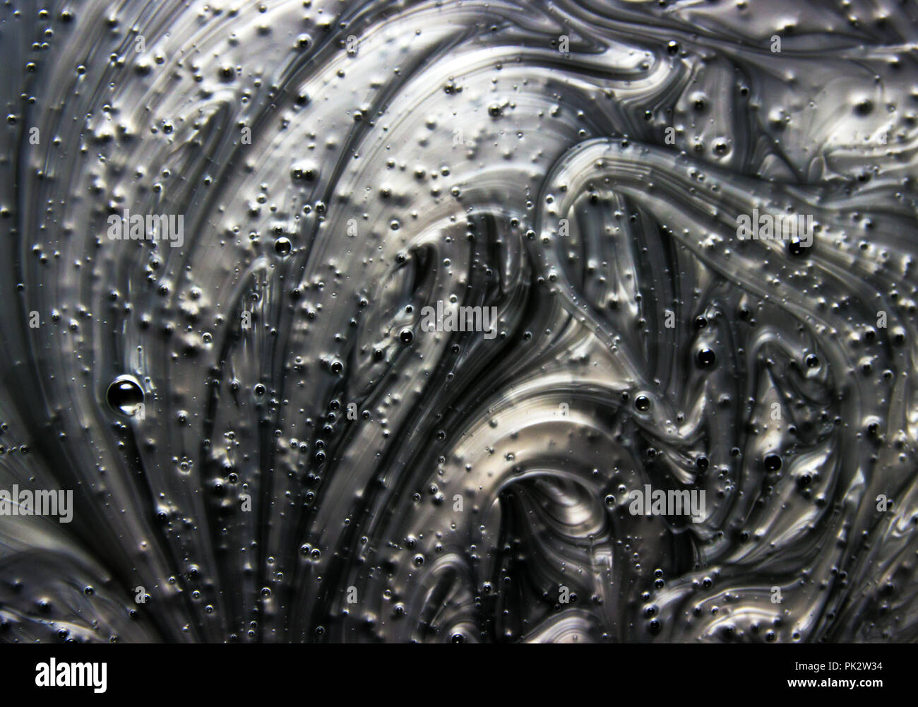 Mix di un argento e nero vernice, closeup. Foto Stock