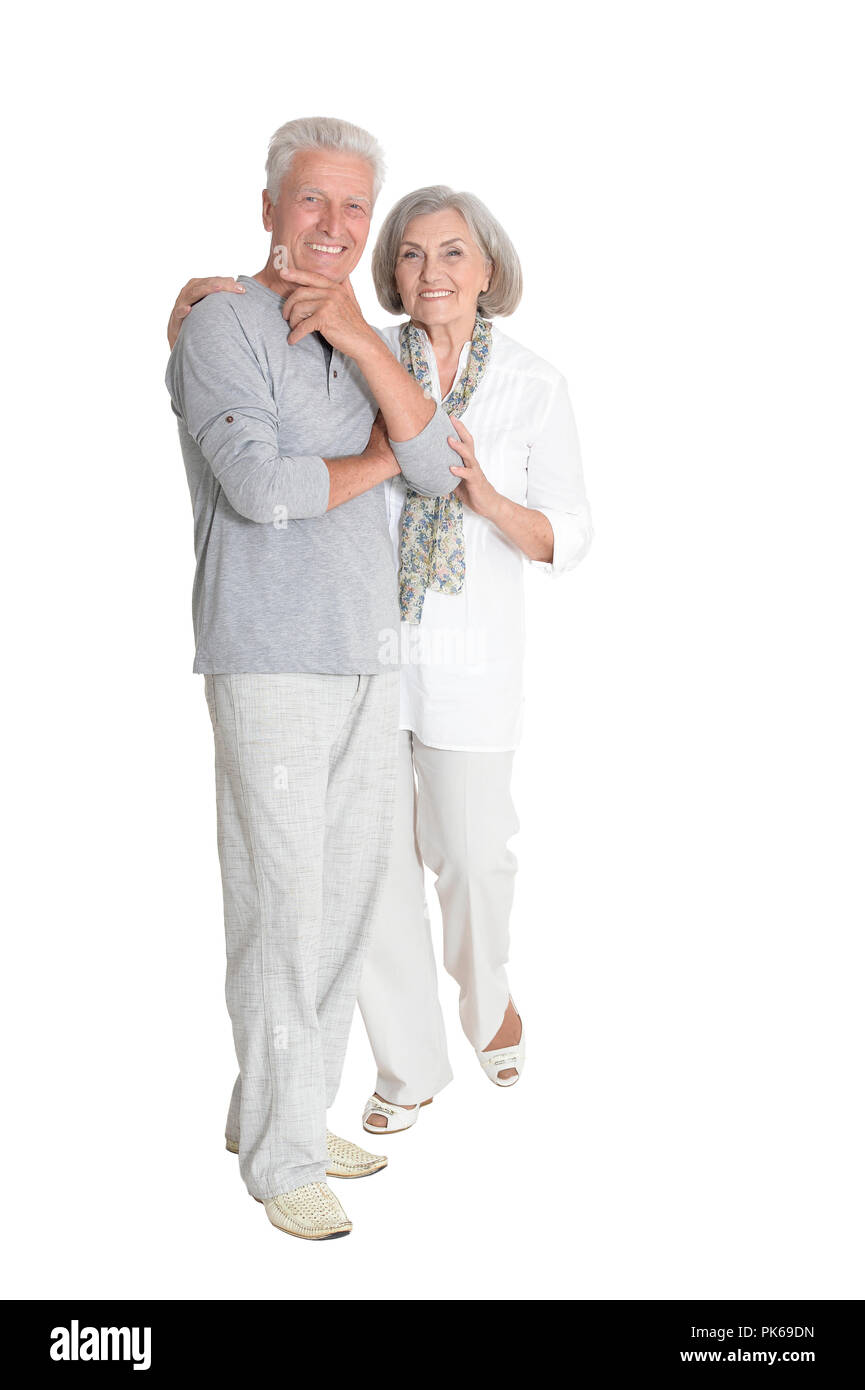 Ritratto di coppia senior abbracciando isolati su sfondo bianco Foto Stock
