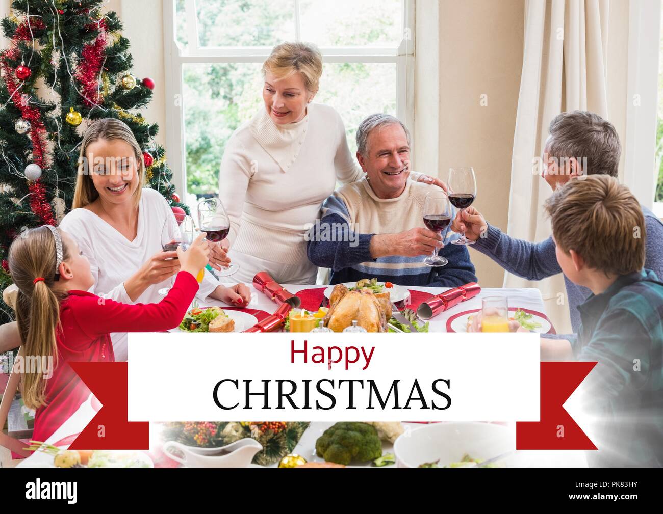 Felice Natale testo con cena in famiglia Foto Stock