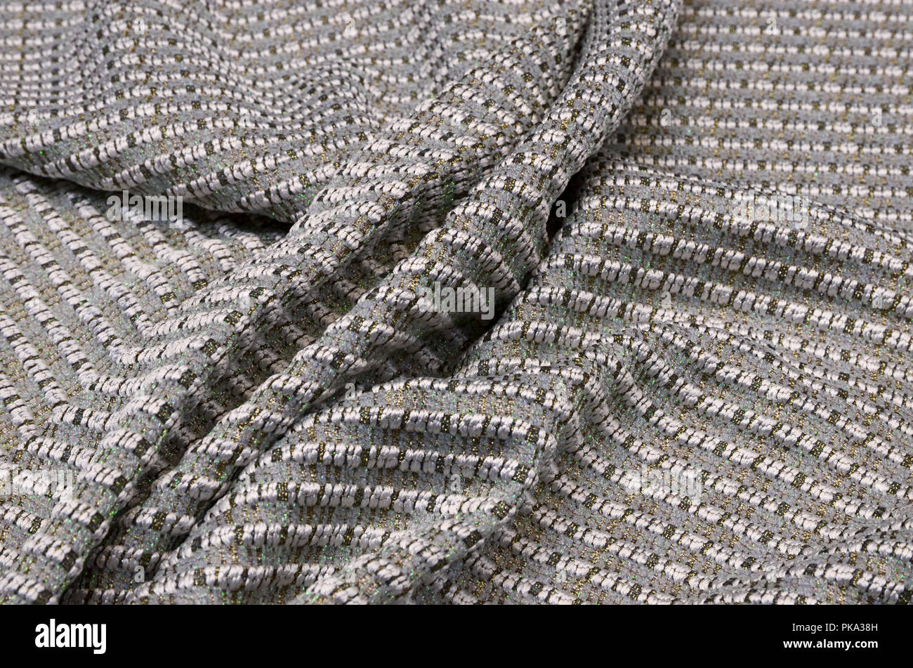Tessuto in lana con acrilici e lurex, grigio con oro Foto Stock