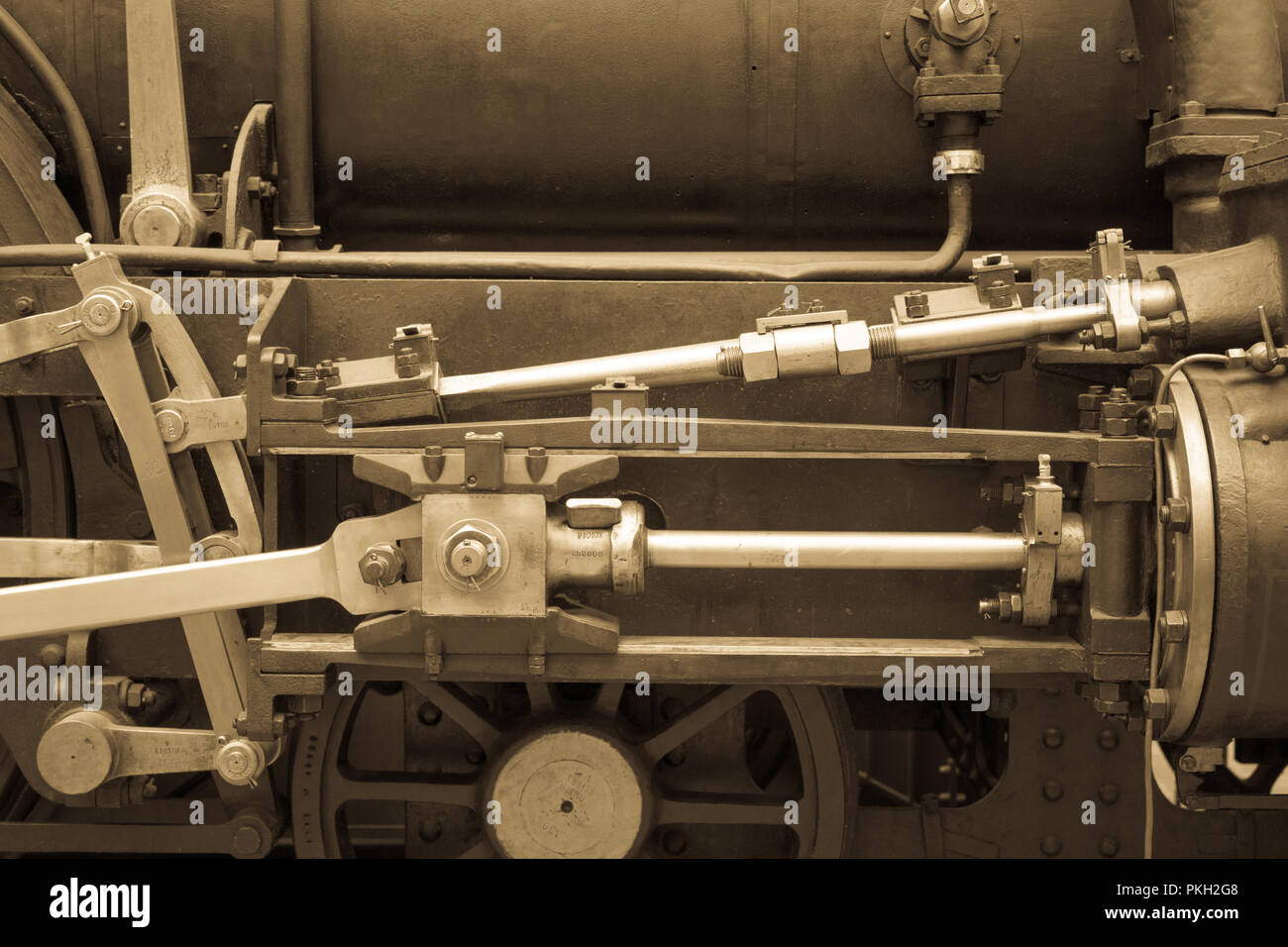 Il vecchio meccanismo tonica foto. In stile retrò macchinari, ingranaggi, ruote dentate metalliche, i dadi e i bulloni. Foto Stock