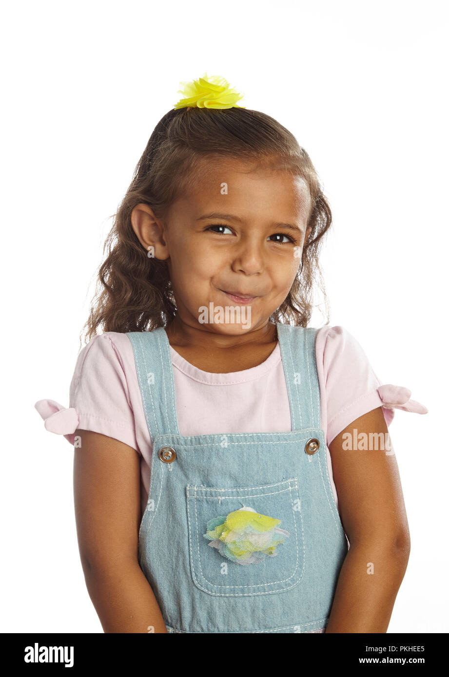 Bambina in tute da lavoro Foto Stock