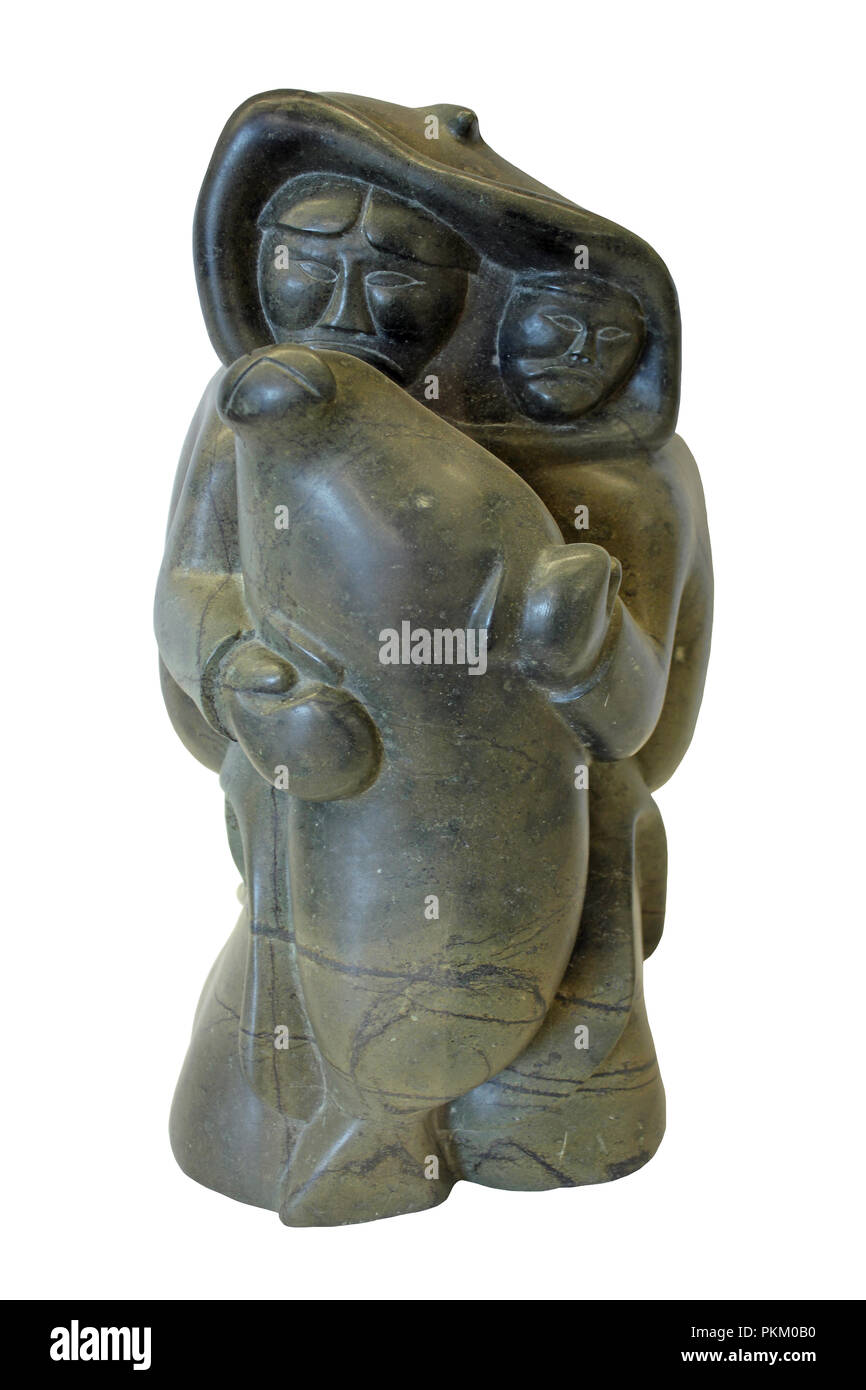 La pietra ollare Inuit Carving di cacciatori con guarnizione Foto Stock