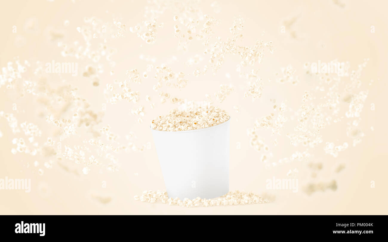 Vuoto bianco benna alimentare con popcorn mockup su sfondo giallo, effetto di profondità di campo, rendering 3d. Svuotare il secchio con la caduta di pop corn mock up. La carta un fast food box modello, isolata. Foto Stock