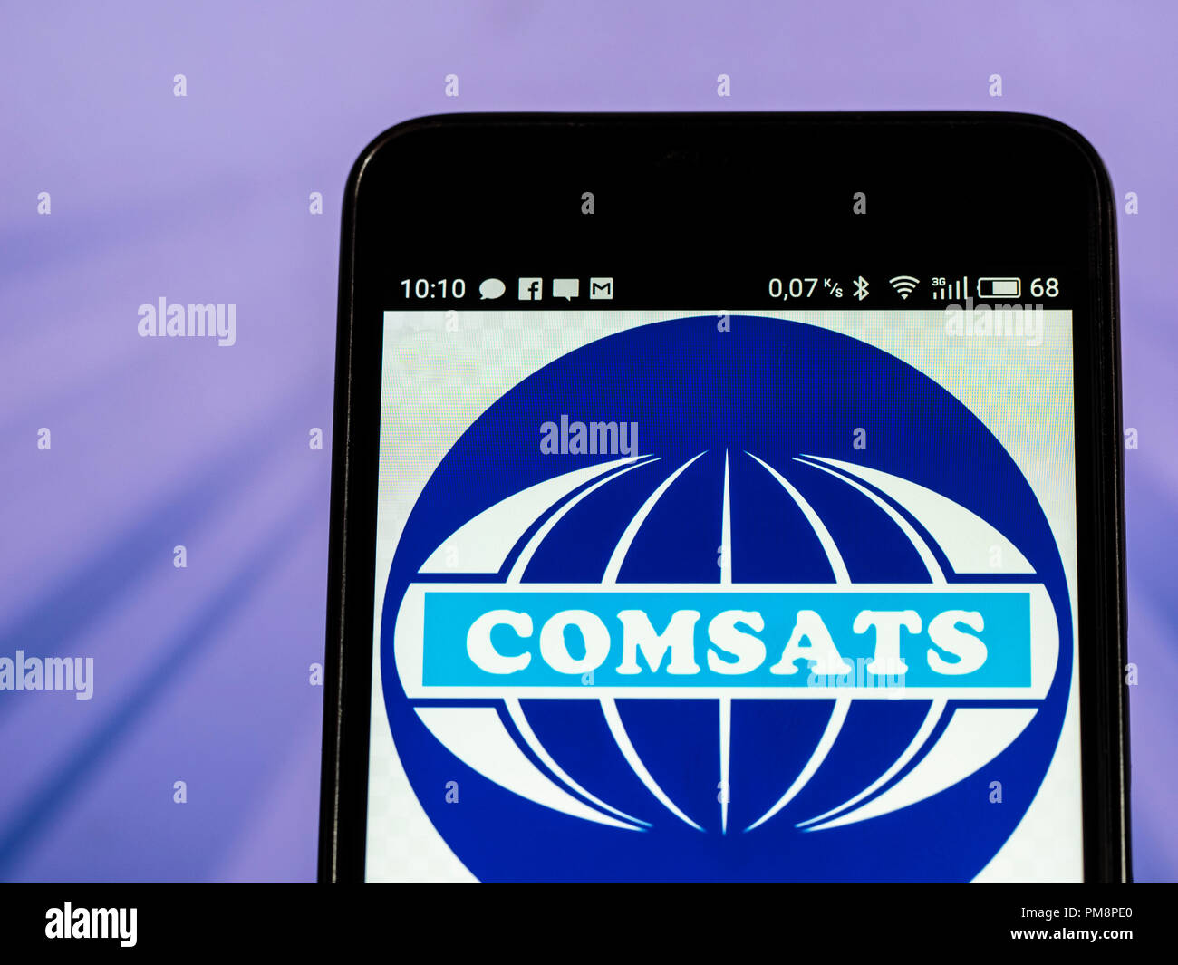 COMSAT (satellite di comunicazioni Corporation) visto il logo visualizzato su un telefono intelligente. Foto Stock