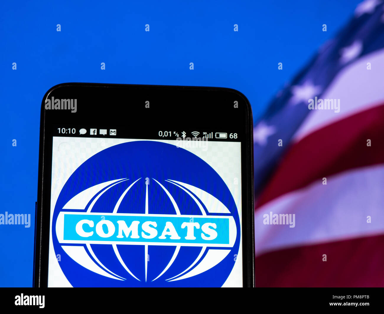 COMSAT (satellite di comunicazioni Corporation) visto il logo visualizzato sul telefono intelligente Foto Stock