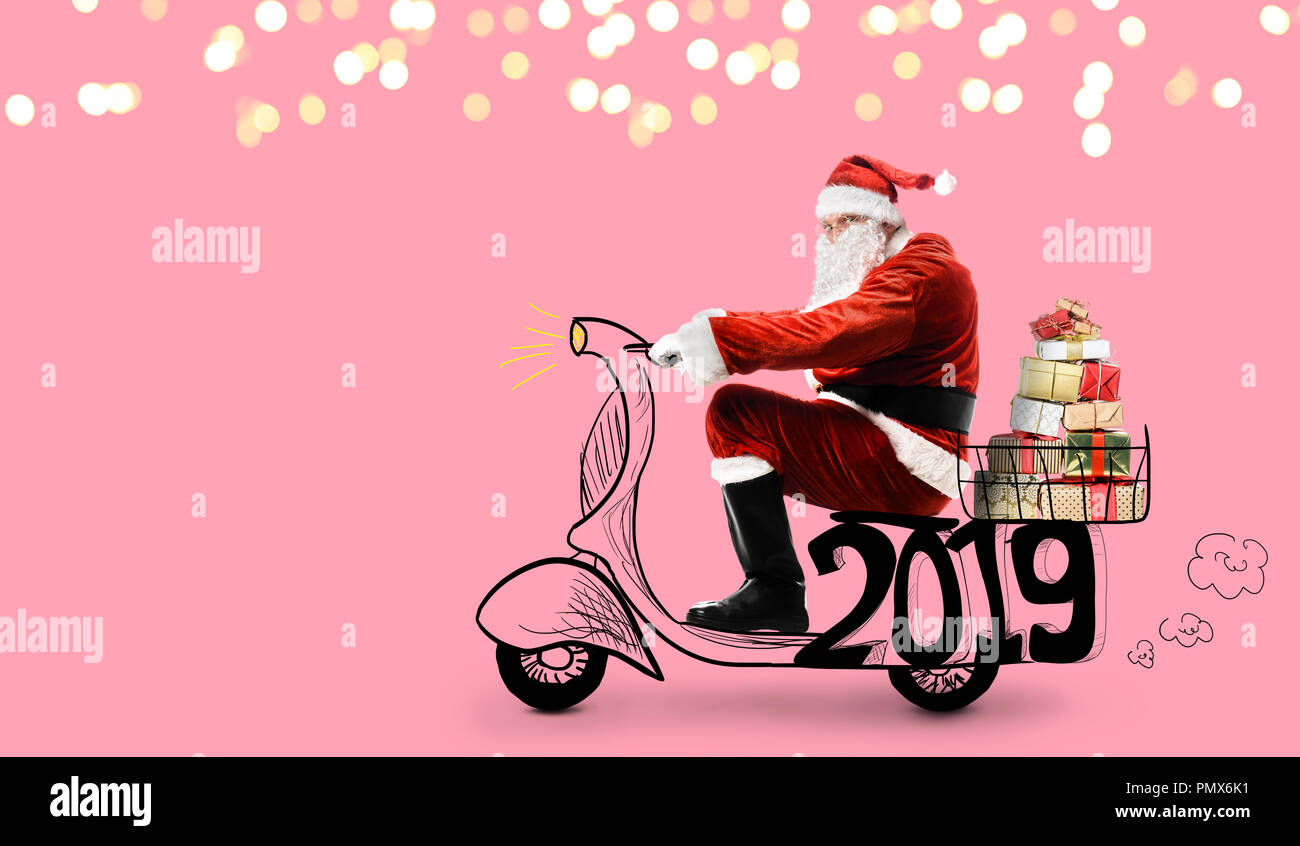 Babbo Natale su scooter Foto Stock