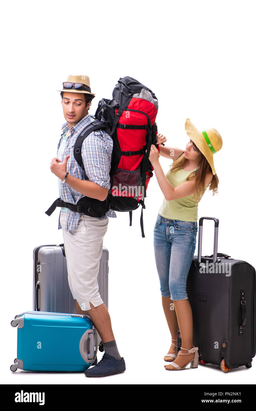 Giovane famiglia preparando per andare in vacanza su bianco Foto Stock